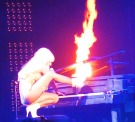 Lady Gaga leg on piano with fire
